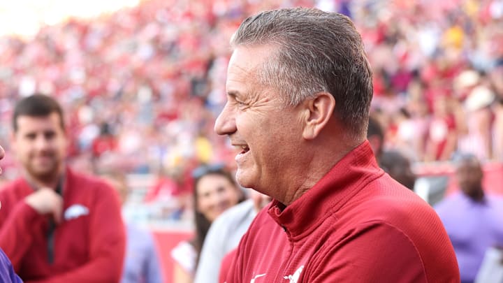 LSU Tigers coach Brian Kelly talks to Arkansas Razorbacks men’s basketball coach John Calipari prior to a game at Razorback Stadium. LSU Tigers coach Brian Kelly talks to Arkansas Razorbacks men’s basketball coach John Calipari prior to a game at Razorback Stadium.