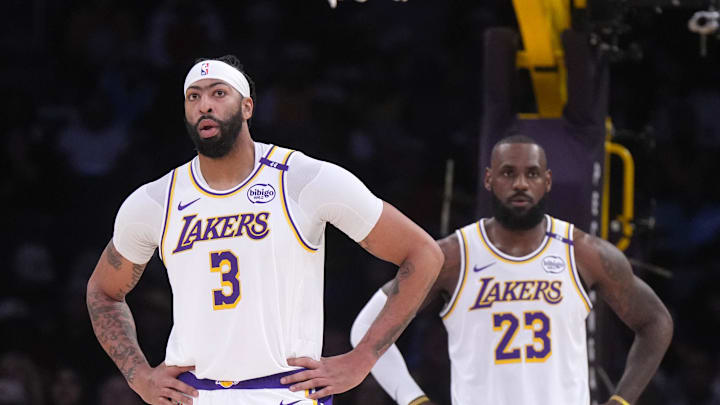 Dec 15, 2024; Los Angeles, California, USA; Los Angeles Lakers forward Anthony Davis (3) and forward LeBron James (23) react in the first half against the Memphis Grizzlies at Crypto.com Arena. Mandatory Credit: Kirby Lee-Imagn Images