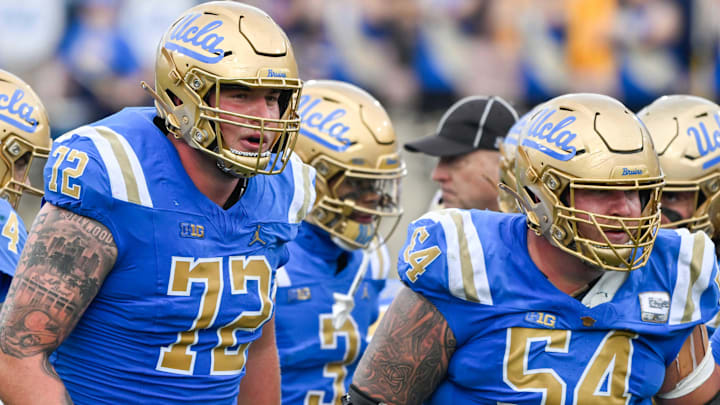 Nov 30, 2024; Pasadena, California, USA; UCLA Bruins offensive linemen Garrett DiGiorgio (72) and Josh Carlin (54) during the second quarter against the Fresno State Bulldogs at Rose Bowl. Mandatory Credit: Robert Hanashiro-Imagn Images