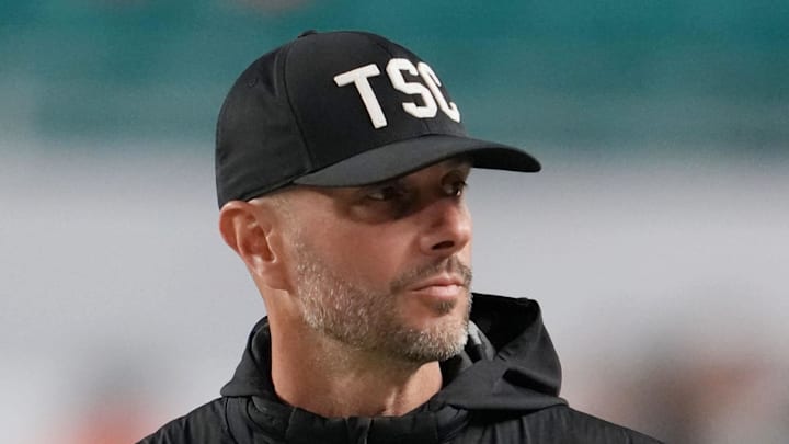 Jan 19, 2026; Miami Gardens, FL, USA; Las Vegas Raiders general manager John Spytek walks on the sideline before the CFP National Championship college football game between the Indiana Hoosiers and the Miami Hurricanes at Hard Rock Stadium. Mandatory Credit: Kirby Lee-Imagn Images