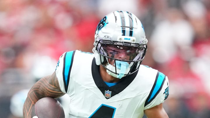 Carolina Panthers wide receiver Tetairoa McMillan runs with the ball during the first quarter against the Arizona Cardinals.