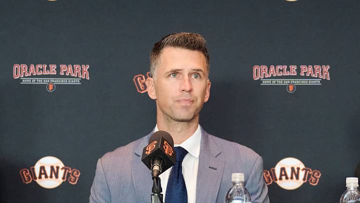 San Francisco, CA, USA; San Francisco Giants manager Bob Melvin (left), president of baseball operations Buster Posey (middle), and chairman Greg Johnson during a press conference at Oracle Park.  Mandatory Credit: Robert Edwards-Imagn Images