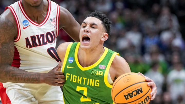 Mar 23, 2025; Seattle, WA, USA;  Oregon Ducks guard Jackson Shelstad (3) dribbles the ball against Arizona Wildcats guard Jaden Bradley (0) in the second half at Climate Pledge Arena. Mandatory Credit: Stephen Brashear-Imagn Images