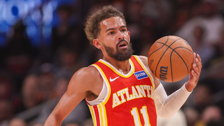 Oct 22, 2025; Atlanta, Georgia, USA; Atlanta Hawks guard Trae Young (11) dribbles against the Toronto Raptors in the first quarter at State Farm Arena.