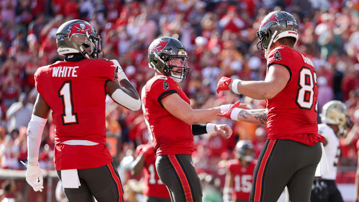 Jan 5, 2025; Tampa, Florida, USA; Tampa Bay Buccaneers quarterback Baker Mayfield (6) celebrates with tight end Payne Durham (87) after scoring a touchdown against the New Orleans Saints in the third quarter at Raymond James Stadium. Mandatory Credit: Nathan Ray Seebeck-Imagn Images Jan 5, 2025; Tampa, Florida, USA; Tampa Bay Buccaneers quarterback Baker Mayfield (6) celebrates with tight end Payne Durham (87) after scoring a touchdown against the New Orleans Saints in the third quarter at Raymond James Stadium. Mandatory Credit: Nathan Ray Seebeck-Imagn Images