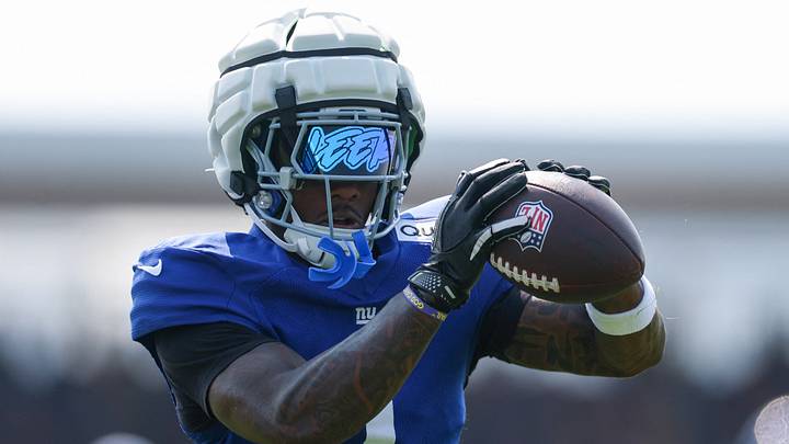 New York Giants wide receiver Malik Nabers (1) makes a catch during training camp at Quest Diagnostics Training Center. New York Giants wide receiver Malik Nabers (1) makes a catch during training camp at Quest Diagnostics Training Center.