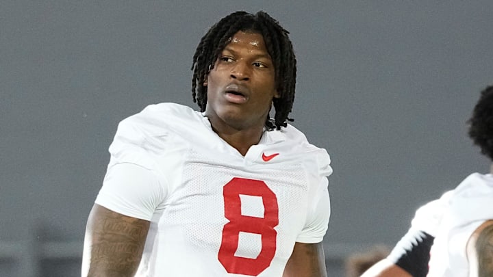 Ohio State Buckeyes linebackers coach James Laurinaitis works with linebacker Arvell Reese (8) during spring football practice at the Woody Hayes Athletic Center on March 17, 2025.