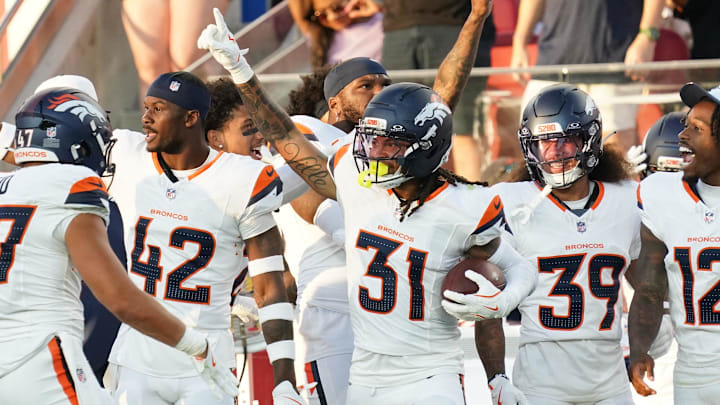 Aug 9, 2025; Santa Clara, California, USA;  Denver Broncos inside linebacker Karene Reid (47) and safety Drew Sanders (42) and cornerback Kris Abrams–Draine (31) and cornerback Joshua Pickett (39) and cornerback Jahdae Barron (12) celebrate an interception, that was later nullified, in the third quarter against the San Francisco 49ers at Levi's Stadium.