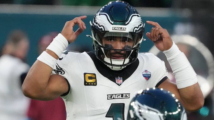 Philadelphia Eagles quarterback Jalen Hurts (1) signals during the second half against the Jacksonville Jaguars at Tottenham Hotspur Stadium.  Mandatory Credit: Kirby Lee-Imagn Images