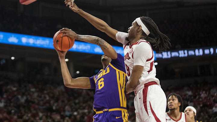 Arkansas Razorbacks forward Jonas Aidoo (9) goes up to block a shot by LSU Tigers forward Robert Miller III (6) during the first half at Bud Walton Arena. 