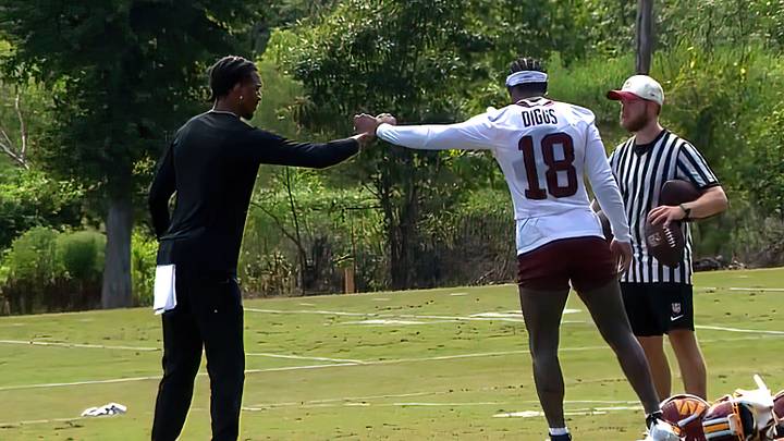 Washington Commanders quarterback Jayden Daniels and wide receiver Stefon Diggs greet each other during Friday’s training camp practice in Ashburn, Va. Washington Commanders quarterback Jayden Daniels and wide receiver Stefon Diggs greet each other during Friday’s training camp practice in Ashburn, Va.