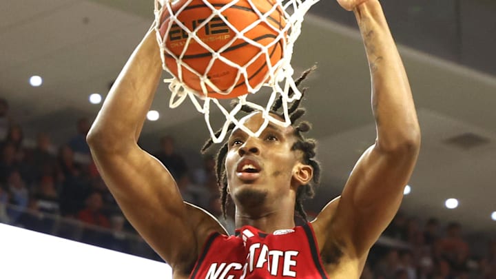 Dec 3, 2025; Auburn, Alabama, USA;  NC State Wolfpack guard Jr. Paul McNeil (2) dunks during the first half against the Auburn Tigers at Neville Arena. Mandatory Credit: John Reed-Imagn Images