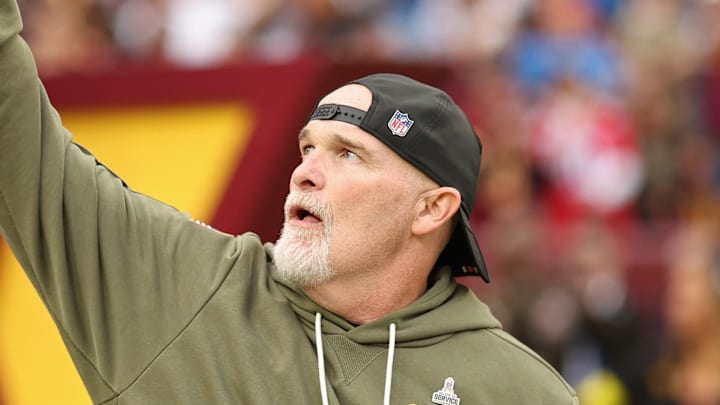 Washington Commanders head coach Dan Quinn runs onto the field prior to the Commanders' game against the Detroit Lions. Washington Commanders head coach Dan Quinn runs onto the field prior to the Commanders' game against the Detroit Lions.