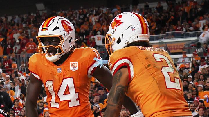Tampa Bay Buccaneers wide receiver Chris Godwin Jr. (14) celebrates with wide receiver Emeka Egbuka (2) Tampa Bay Buccaneers wide receiver Chris Godwin Jr. (14) celebrates with wide receiver Emeka Egbuka (2)