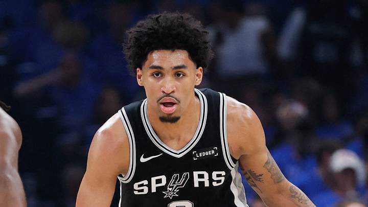 May 18, 2026; Oklahoma City, Oklahoma, USA; San Antonio Spurs guard Dylan Harper (2) drives the ball while defended by Oklahoma City Thunder guard Cason Wallace (22) in the first quarter during game one of the western conference finals for the 2026 NBA playoffs at Paycom Center. Mandatory Credit: Alonzo Adams-Imagn Images