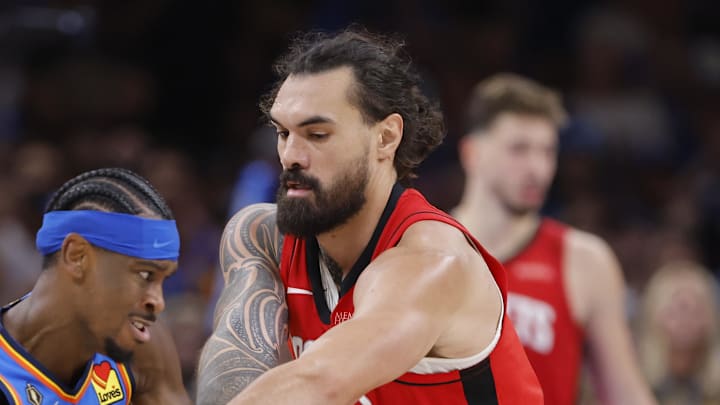 Oct 21, 2025; Oklahoma City, Oklahoma, USA; Oklahoma City Thunder guard Shai Gilgeous-Alexander (2) works to keep the ball away from Houston Rockets center Steven Adams (12) during the second half at Paycom Center. Mandatory Credit: Alonzo Adams-Imagn Images