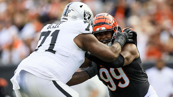 Nov 3, 2024; Cincinnati, Ohio, USA; Las Vegas Raiders offensive tackle DJ Glaze (71) pushes against Cincinnati Bengals defensive end Myles Murphy (99) in the second half at Paycor Stadium. Mandatory Credit: Katie Stratman-Imagn Images