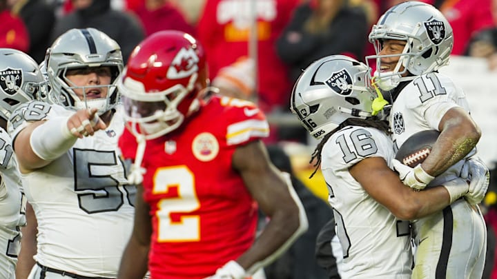 Nov 29, 2024; Kansas City, Missouri, USA; Las Vegas Raiders wide receiver Tre Tucker (11) celebrates with wide receiver Jakobi Meyers (16) after scoring a touchdown during the second half against the Kansas City Chiefs at GEHA Field at Arrowhead Stadium. Mandatory Credit: Jay Biggerstaff-Imagn Images