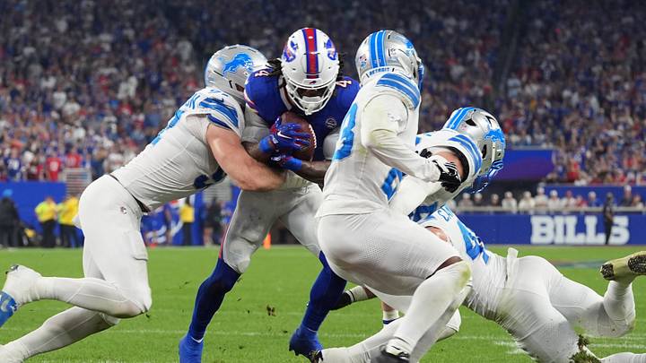 Detroit Lions defensive end Aidan Hutchinson (97) and linebacker Jack Campbell (46) tackle Buffalo Bills RB James Cook Detroit Lions defensive end Aidan Hutchinson (97) and linebacker Jack Campbell (46) tackle Buffalo Bills RB James Cook
