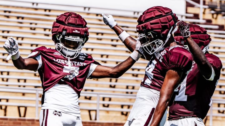 Mississippi State players celebrate during a fall scrimmage in Starkville. The Bulldogs' offense may have a lot to celebrate this season with a new coach, quarterback, offensive system and rule changes combine for a fast-paced offense.