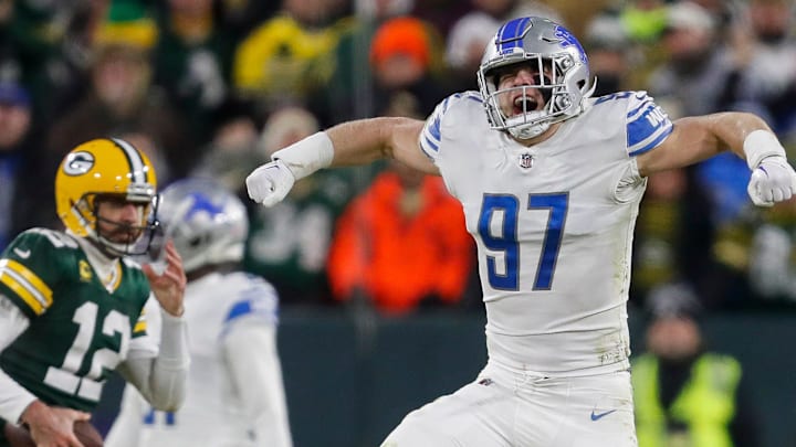 Detroit Lions defensive end Aidan Hutchinson (97) celebrates after sacking former Green Bay Packers quarterback Aaron Rodgers