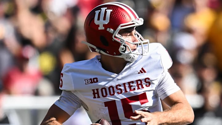 Sep 27, 2025; Iowa City, Iowa, USA; Indiana Hoosiers quarterback Fernando Mendoza (15) throws a pass against the Iowa Hawkeyes during the second quarter at Kinnick Stadium. Mandatory Credit: Jeffrey Becker-Imagn Images