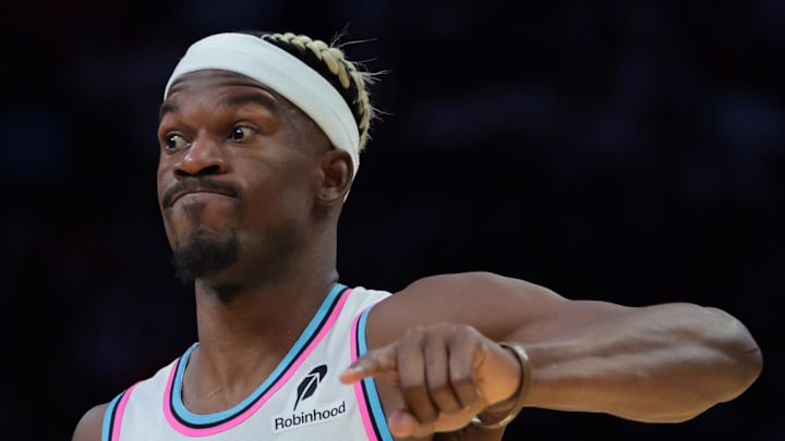 Jan 17, 2025; Miami, Florida, USA; Miami Heat forward Jimmy Butler (22) reacts as Denver Nuggets forward Peyton Watson (8) defends during the fourth quarter at Kaseya Center. Mandatory Credit: Sam Navarro-Imagn Images Jan 17, 2025; Miami, Florida, USA; Miami Heat forward Jimmy Butler (22) reacts as Denver Nuggets forward Peyton Watson (8) defends during the fourth quarter at Kaseya Center. Mandatory Credit: Sam Navarro-Imagn Images