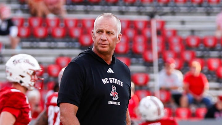 Aug 28, 2025; Raleigh, North Carolina, USA; North Carolina State Wolfpack head coach Dave Doeren walks among his players during the warmups prior to the game against East Carolina Pirates at Carter-Finley Stadium. Mandatory Credit: Jaylynn Nash-Imagn Images Aug 28, 2025; Raleigh, North Carolina, USA; North Carolina State Wolfpack head coach Dave Doeren walks among his players during the warmups prior to the game against East Carolina Pirates at Carter-Finley Stadium. Mandatory Credit: Jaylynn Nash-Imagn Images