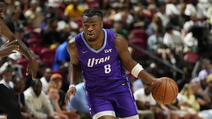 Jul 14, 2025; Las Vegas, NV, USA;  Utah Jazz guard Isaiah Collier (8) dribbles the ball against San Antonio Spurs forward David Jones-Garcia (25) during the first half of a NBA basketball game at the Thomas & Mack Center. Mandatory Credit: Lucas Peltier-Imagn Images