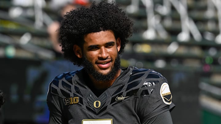Sep 20, 2025; Eugene, Oregon, USA; Oregon Ducks quarterback Dante Moore (5) warms up before the game against the Oregon State Beavers at Autzen Stadium. Mandatory Credit: Troy Wayrynen-Imagn Images