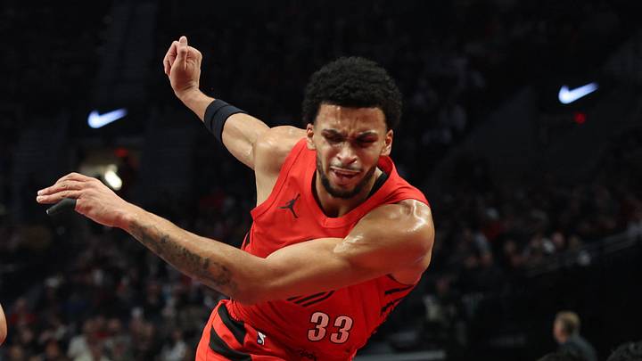 Nov 26, 2025; Portland, Oregon, USA;  Portland Trail Blazers forward Toumani Camara (33) reacts after being bumped by San Antonio Spurs forward Carter Bryant (11) in the first half at Moda Center. Mandatory Credit: Jaime Valdez-Imagn Images