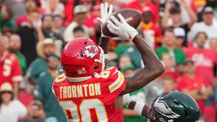 Sep 14, 2025; Kansas City, Missouri, USA; Kansas City Chiefs wide receiver Tyquan Thornton (80) makes a reception for a touchdown defended by Philadelphia Eagles cornerback Quinyon Mitchell (27) during the fourth quarter of the game at GEHA Field at Arrowhead Stadium. Mandatory Credit: Denny Medley-Imagn Images Sep 14, 2025; Kansas City, Missouri, USA; Kansas City Chiefs wide receiver Tyquan Thornton (80) makes a reception for a touchdown defended by Philadelphia Eagles cornerback Quinyon Mitchell (27) during the fourth quarter of the game at GEHA Field at Arrowhead Stadium. Mandatory Credit: Denny Medley-Imagn Images