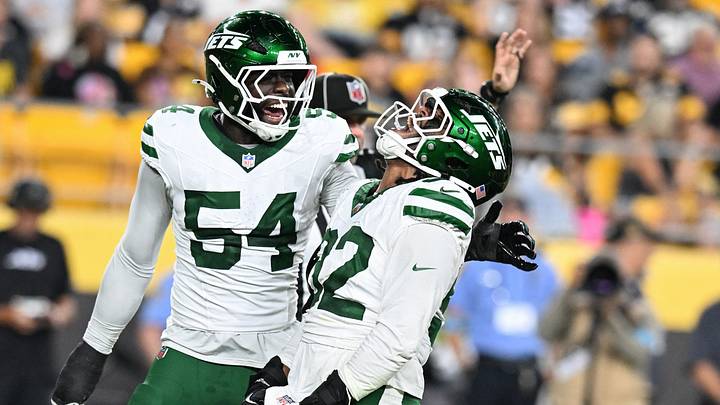 New York Jets defensive end Nate Lynn celebrates with New York Jets defensive end Paschal Ekeji