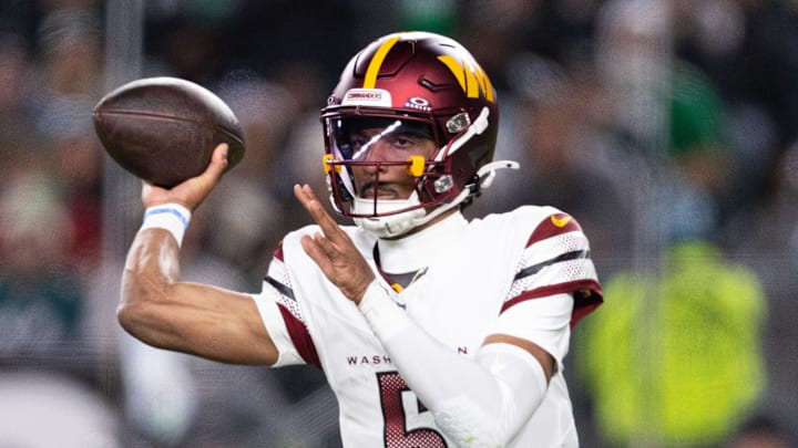 Nov 14, 2024; Philadelphia, Pennsylvania, USA; Washington Commanders quarterback Jayden Daniels (5) throws the ball against the Philadelphia Eagles during the second quarter at Lincoln Financial Field. Mandatory Credit: Bill Streicher-Imagn Images