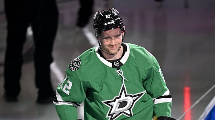 Feb 4, 2026; Dallas, Texas, USA; Dallas Stars center Radek Faksa (12) takes the ice as the Stars celebrate their 2026 Winter Olympics hockey players before the game against the St. Louis Blues at the American Airlines Center. Mandatory Credit: Jerome Miron-Imagn Images