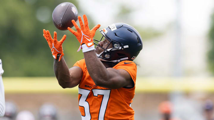 Denver Broncos rookie running back RJ Harvey (37) catches a pass over his shoulder during voluntary minicamp. Denver Broncos rookie running back RJ Harvey (37) catches a pass over his shoulder during voluntary minicamp.