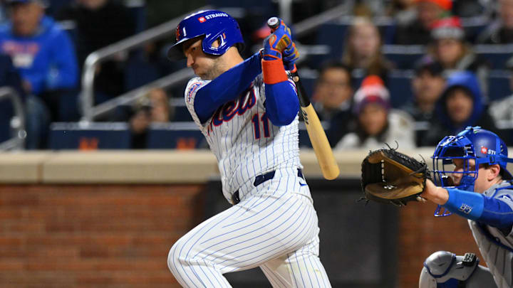 Oct 17, 2024; New York City, New York, USA; New York Mets second base Jose Iglesias (11) hits a single in the second inning during game four of the NLCS for the 2024 MLB playoffs at Citi Field. Mandatory Credit: John Jones-Imagn Images