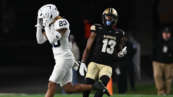 Nov 16, 2024; West Lafayette, Indiana, USA; Penn State Nittany Lions cornerback Antoine Belgrave-Shorter (23) reacts to missing an interception in front of Purdue Boilermakers wide receiver Jaron Tibbs (13) during the second half at Ross-Ade Stadium. Mandatory Credit: Marc Lebryk-Imagn Images