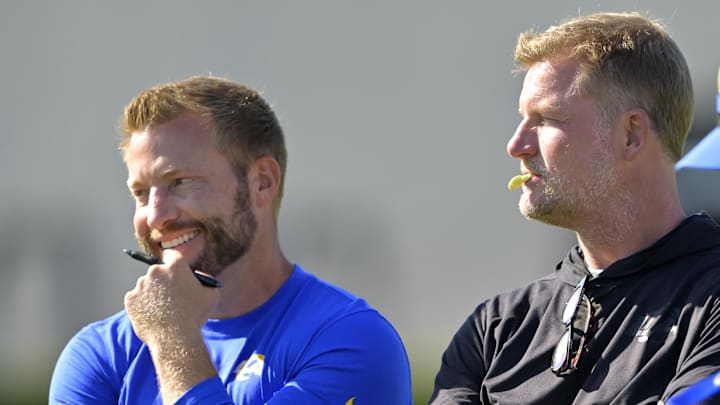 Jul 29, 2024; Los Angeles, CA, USA; Los Angeles Rams head coach Sean McVay, general manager Les Snead and chief of staff Carter Crutchfield talk on the field during training camp at Loyola Marymount University. Mandatory Credit: Jayne Kamin-Oncea-Imagn Images