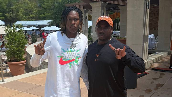 Texas Longhorns recruiting target John Meredith with defensive backs coach Mark Orphey Texas Longhorns recruiting target John Meredith with defensive backs coach Mark Orphey
