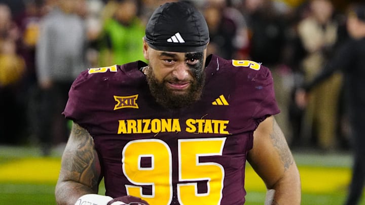 Arizona State defensive lineman Justin Wodtly (95) cries as he takes the field during a senior night ceremony before a game against Arizona at Mountain America Stadium in Tempe, Ariz. on Nov. 28, 2025. Arizona State defensive lineman Justin Wodtly (95) cries as he takes the field during a senior night ceremony before a game against Arizona at Mountain America Stadium in Tempe, Ariz. on Nov. 28, 2025.