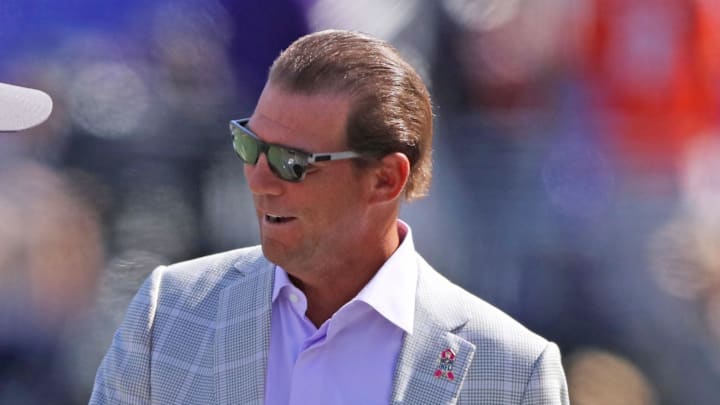 Oct 11, 2015; Baltimore, MD, USA; Baltimore Ravens head coach John Harbaugh (left) and team owner Steve Biscotti (right) meet prior to the game against the Cleveland Browns at M&T Bank Stadium. Mandatory Credit: Mitch Stringer-Imagn Images