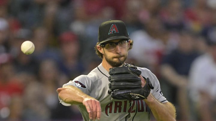 Jul 12, 2025; Anaheim, California, USA;  Arizona Diamondbacks starting pitcher Zac Gallen (23) throws Los Angeles Angels left fielder Taylor Ward (3) out at first base during the fifth inning at Angel Stadium. Mandatory Credit: Jayne Kamin-Oncea-Imagn Images