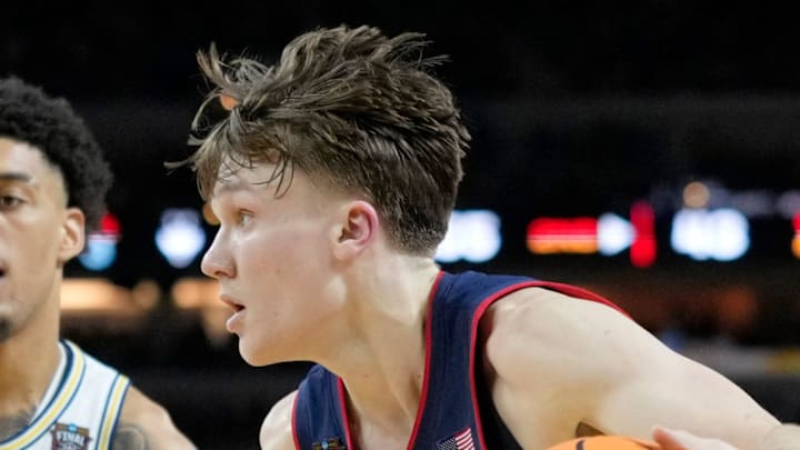 UConn Huskies guard Braylon Mullins (24) drives to the basket Monday, April 6, 2026, against the Michigan Wolverines during the NCAA men's basketball tournament national championship game at Lucas Oil Stadium in Indianapolis.