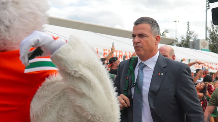 Oct 17, 2025; Miami Gardens, Florida, USA; Miami Hurricanes head coach Mario Cristobal during the Hurricane Walk before the game against the Louisville Cardinals at Hard Rock Stadium. Mandatory Credit: Sam Navarro-Imagn Images Oct 17, 2025; Miami Gardens, Florida, USA; Miami Hurricanes head coach Mario Cristobal during the Hurricane Walk before the game against the Louisville Cardinals at Hard Rock Stadium. Mandatory Credit: Sam Navarro-Imagn Images
