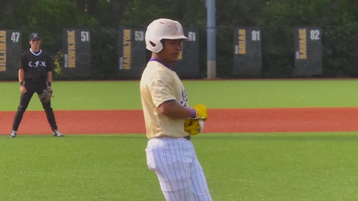 Male High School player Kaiden Ford takes a base after being hit by a pitch in a matchup against St. X April 15, 2026. Male and Trinity are the frontrunners in the Big Four.