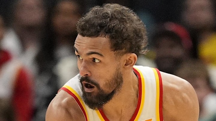 Trae Young #11 of the Atlanta Hawks looks to make a play against the Charlotte Hornets.