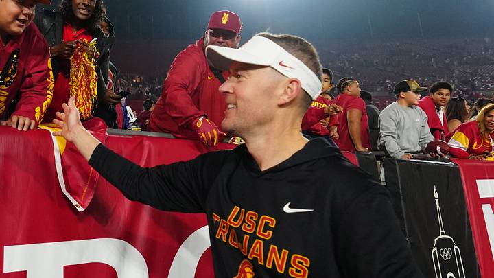 Nov 29, 2025; Los Angeles, California, USA; Southern California Trojans head coach Lincoln Riley celebrates with fans after the game against the UCLA Bruins at United Airlines Field at Los Angeles Memorial Coliseum. Nov 29, 2025; Los Angeles, California, USA; Southern California Trojans head coach Lincoln Riley celebrates with fans after the game against the UCLA Bruins at United Airlines Field at Los Angeles Memorial Coliseum.