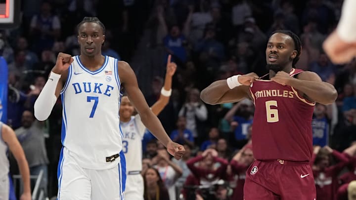 Mar 12, 2026; Charlotte, NC, USA; Duke Blue Devils guard Dame Sarr (7) and Florida State Seminoles guard Robert McCray V. (6) react at the end of the game at Spectrum Center. Mandatory Credit: Bob Donnan-Imagn Images