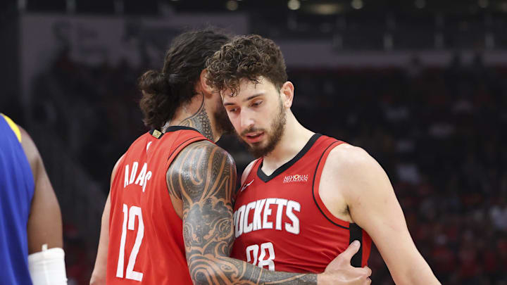 Apr 20, 2025; Houston, Texas, USA; Houston Rockets center Steven Adams (12) talks with center Alperen Sengun (28) after a play during the third quarter against the Golden State Warriors at Toyota Center. Mandatory Credit: Troy Taormina-Imagn Images